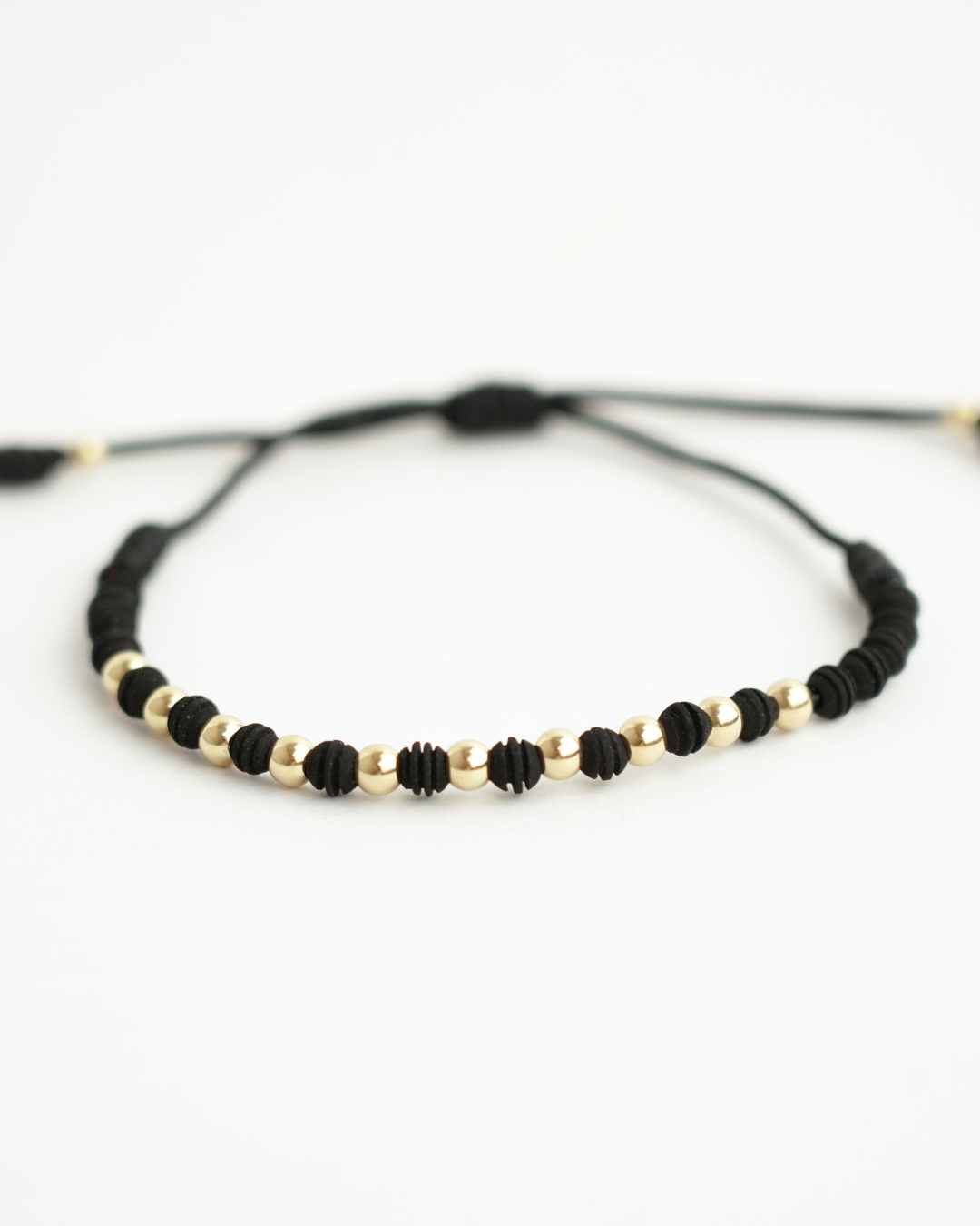 PULSERA DENARIO NEOPRENO ORO AMARILLO